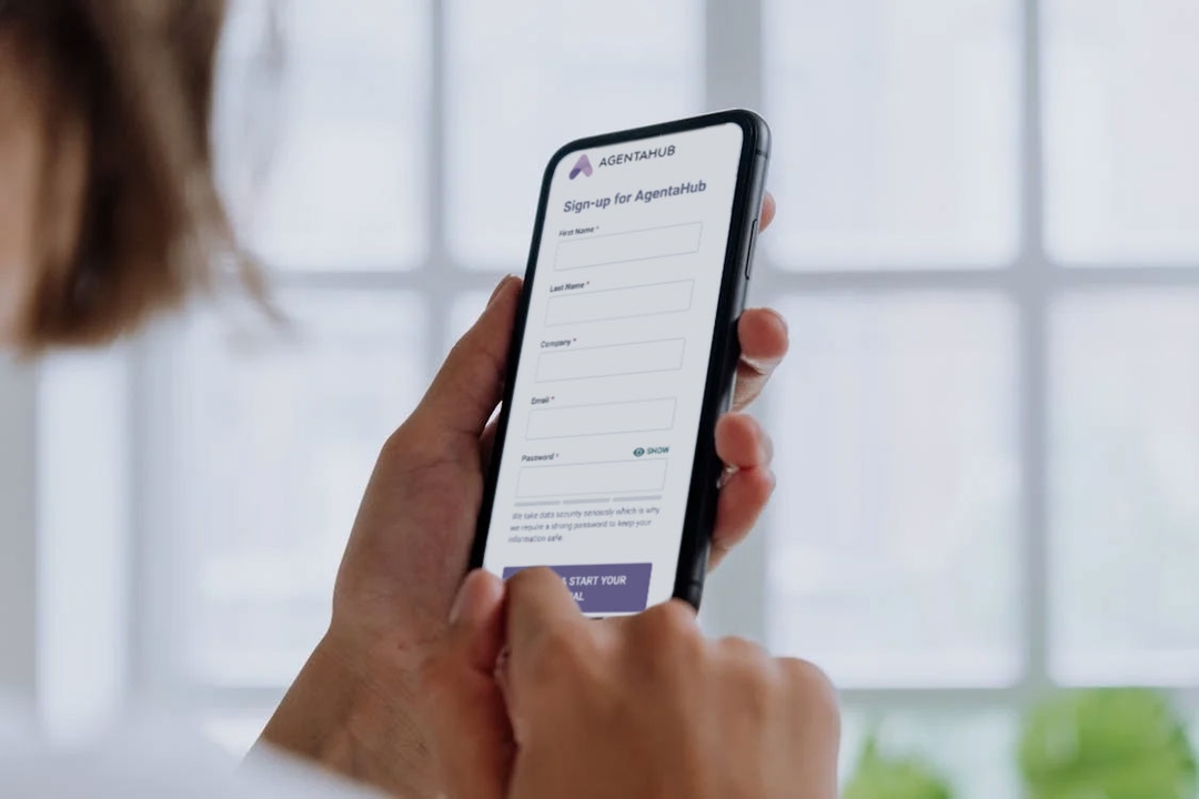 User registering on AgentaHub via a mobile app form.