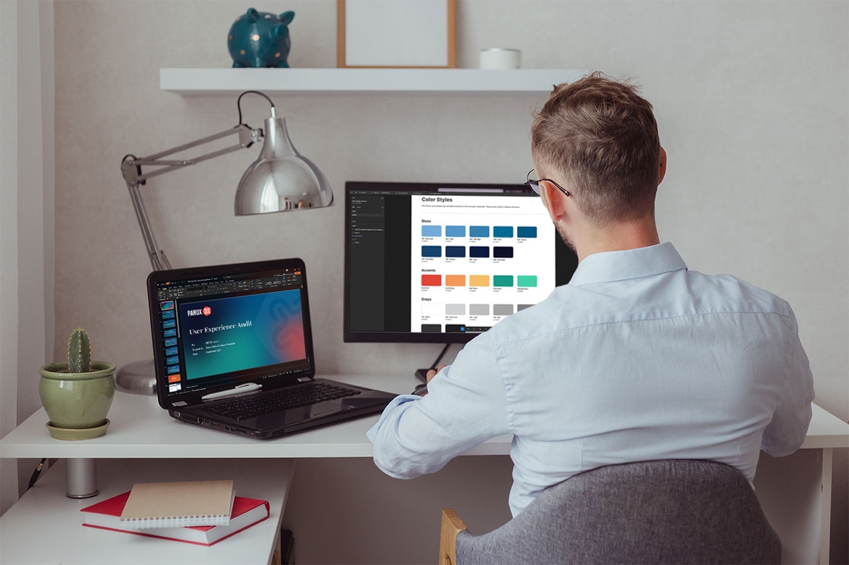 Person working on a color styles design at a desk.